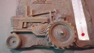 lot 910 image: John Deere Tractor Plaque- Resin.