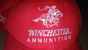 lot 688 image: Winchester Ammunition Cap.