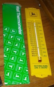 lot 90 image: John Deere Hanging Vintage Gauge.