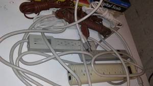 lot 25 image: Surge Protectors And Extension Cords.