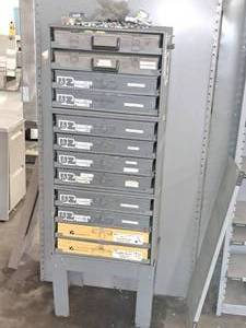 lot 446 image: Metal Parts Organizer Cabinet 12-drawer with Nuts, Bolts, Scotchlocks, Sheet Metal Screws, Cap Screws and Nuts, Push Pins, Cotter Pins, and more