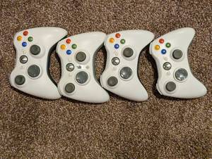 lot 109 image: Four Xbox 360 Controllers