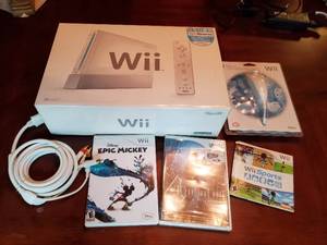 lot 5 image: Wii Gaming System With Games And Accessories