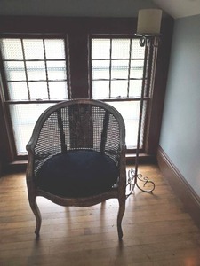 lot 208 image: Cane Armchair And Pillar Candlestand With Candle