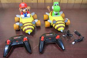 lot 68 image: MarioKart Carrera RC Bumble Mario and Yoshi 2.4 GHz Remote Car Scale 118.