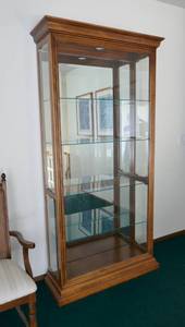 Beautiful lighted display cabinet with 4 glass shelves and side openings