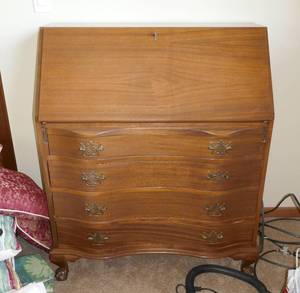 Vintage writing desk with secret compartments and claw feet