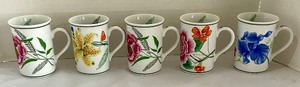 lot 121 image: 5 Chase Flores Mugs by Lynn Chase