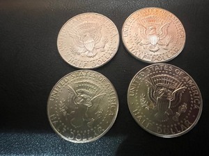 lot 24 image: LOT OF 4 NIFC KENNEDY HALF DOLLARS