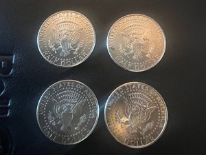 lot 52 image: LOT OF 4 NIFC KENNEDY HALF DOLLARS