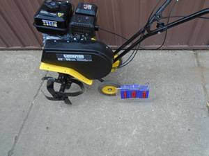 Champion roto tiller. Looks nearly new. Tested & works. Is missing rear bar. As shown.