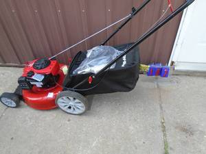 Troy Bilt push mower with bag. New condition. As shown. THIS ITEM HAS A RESERVE.