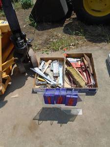 lot 106 image: 2 flats of tools. Pipe wrench, pliers etc. As shown.