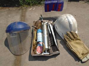 lot 115 image: Grease gun, hard hat & gloves. As shown.