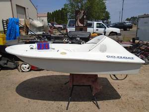 lot 124 image: Go Float fiberglass mini boat. Electric trolling motor power with bilge pump & battery. Been sitting a few years. Check online for info. As shown.