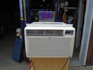 lot 125 image: LG 15000 btu 120v air conditioner. No remote. Tested & works. As shown.