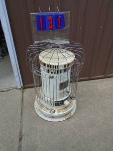 lot 131 image: Vertical kerosene heater. Used condition. As shown.