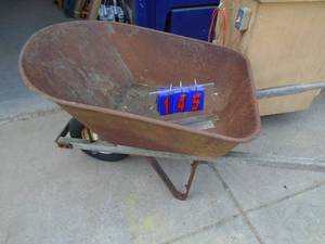 lot 145 image: Used wheelbarrow. Nice shape. Tire holds air. As shown.
