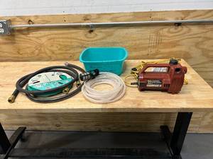 lot 80 image: 331 Model Transfer Pump with Miscellaneous Hoses and Parts