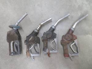 lot 31 image: VINTAGE GAS PUMP NOZZLES  AND FUEL FILTER HOUSINGS