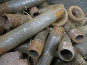 lot 77 image: BUCKET OF LARGER FITTINGS AND PIPE