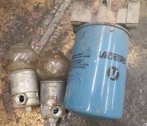 lot 82 image: VINTAGE TRICO OILERS AND FILTER