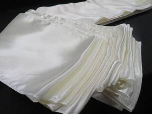 lot 89 image: CREAMY SATIN CHAIR SASHES.