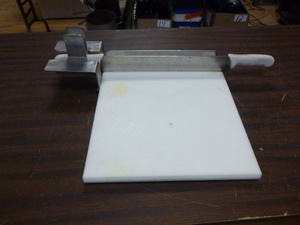 lot 26 image: Cutting Board with Attached Knife