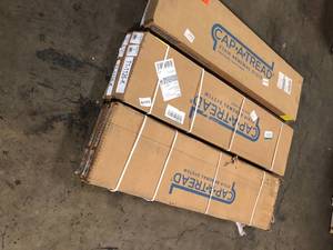 lot 39 image: 6 Boxes of Cap A Tread Ardenmore Oak 1-1116 in. T x 12-18 in. W x 47 in. L for Stairs 1 in. T Stair Tread and Reversible Riser Kit Customer Returns See Pictures