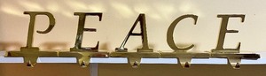 lot 77 image: PEACE 5 piece Christmas Stocking Hangers