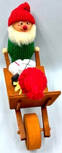 lot 122 image: Wooden Scandinavian Santa with Wheel Barrel