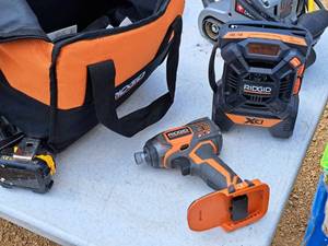 lot 61 image: Ridgid 14 18V Impact Driver R86034 with AMFMMP3 Radio