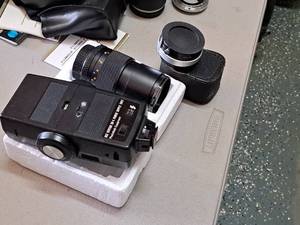 lot 355 image: Lot of (3) Vivitar Camera Accessories - Flash unit, 55mm Skylight Lens, Automatic Tele Converter 2x-5