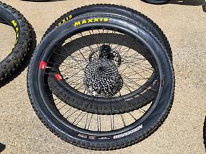 lot 410 image: 23 Front and Rear Bicycle Rims with Maxxis Aggressor 27.5x2.5 Tires, 11-speed Rear Gear Set and Front Disc Brake Assembly