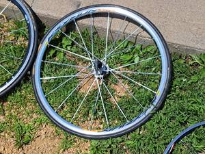 lot 413 image: 24 Rear Bicycle Rim with Tire and 7-speed Gear Set