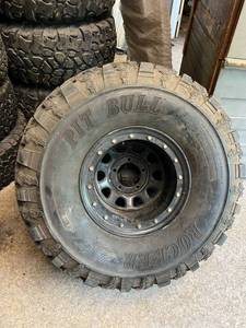 lot 98 image: 2 Pit Bull 37x13.50-15LT Tires on 5 Bolt Rims