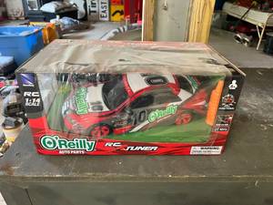 lot 130 image: OReilly RC 114 Scale Remote Control Car NIB