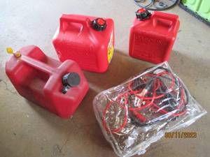 lot 19 image: (3) plastic gas cans and a set of A...