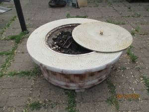 lot 40 image: Metal Outdoor fire pit made to look...