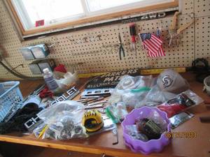 lot 56 image: Craftsman Wrenches and more garage goodies on the benchtop to include an assortment of copper fittings, wire connectors, electrical timers, household maintenance supplies and more