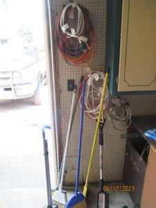 lot 58 image: Extension Cords and brooms to suppl...
