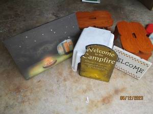 lot 70 image: Light Up Camping Scene Picture, collection of stools and campfire decor