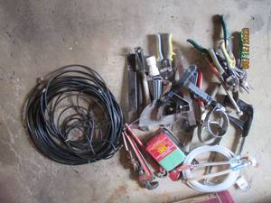 lot 99 image: Oil changing Wrenches, snips, pipe ...