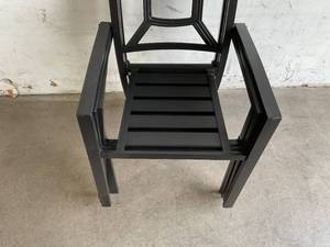 lot 58 image: Set of Four Black Metal Stacking Patio Chairs