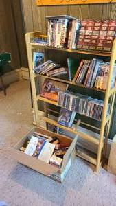 lot 196 image: Dvds, Blu-rays and books on a shelf...