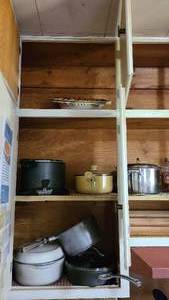 lot 140 image: Contents of cabinets over the stove...