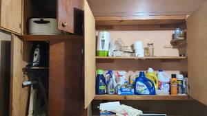 lot 130 image: Cleaning and laundry supply cabinet...