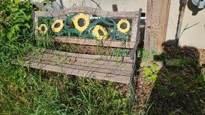 lot 122 image: Sunflower themed cast iron and wood...