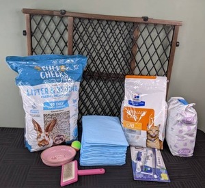 lot 54 image: Assortment of Pet Supplies Gate, Full Cheeks Litter & Bedding, Pee Pads, Hills Prescription Diet, & More