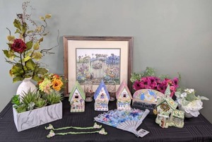 lot 29 image: Country Garden Floral Decor  Artificial Flowers, Framed Artwork, Ceramic Decorative Birdhouses, and More